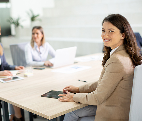 Young Woman Sitting in a Meeting