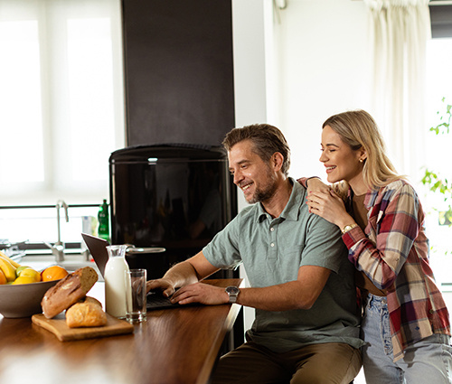 Couple Looking At a Computer